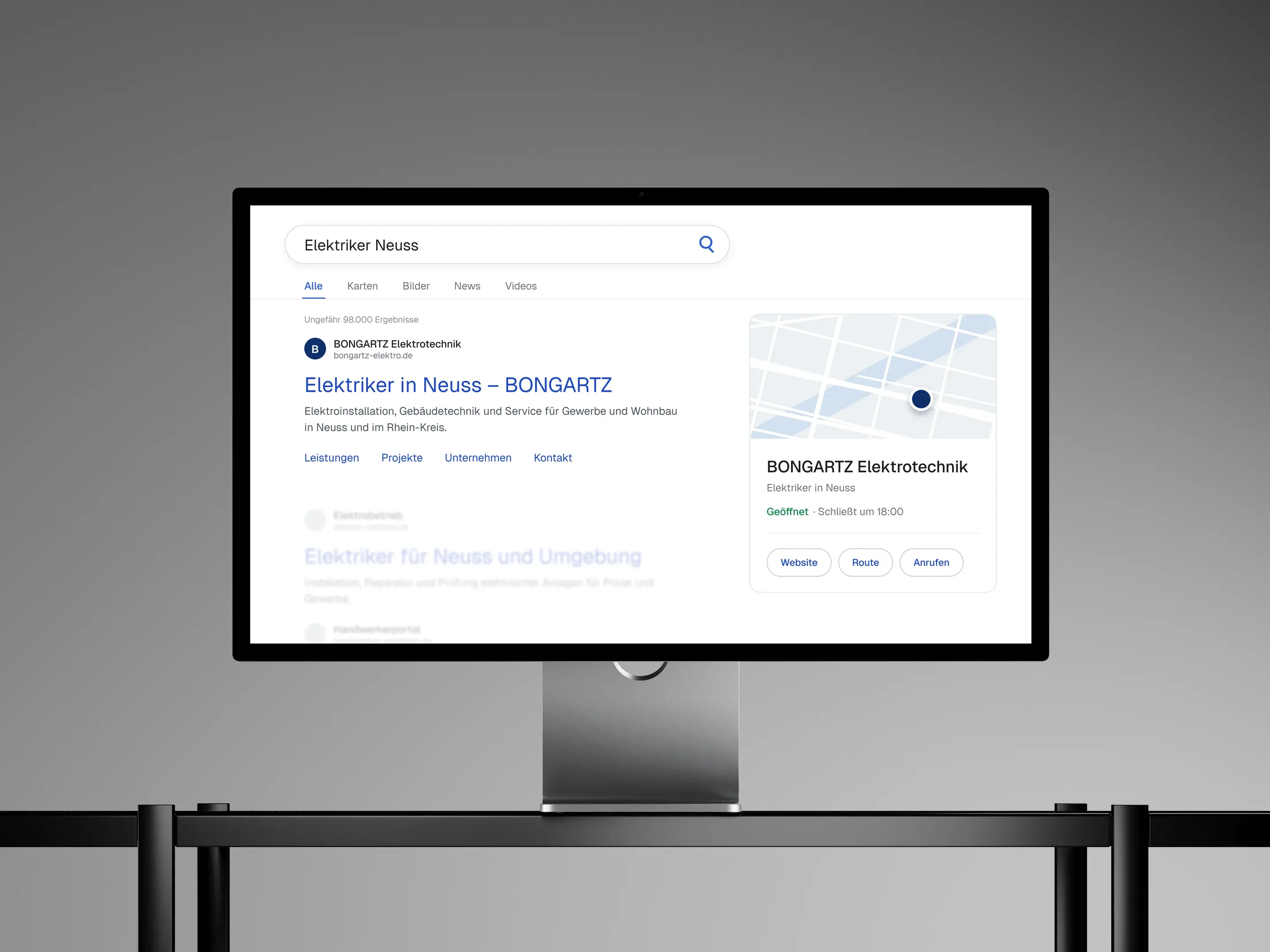 Google-Suchergebnis „Elektriker Neuss“ auf einem iMac
